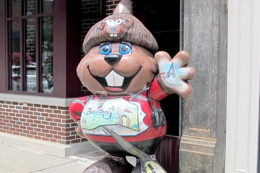 Fiberglass tourist groundhog in front of the Chamber of Commerce office