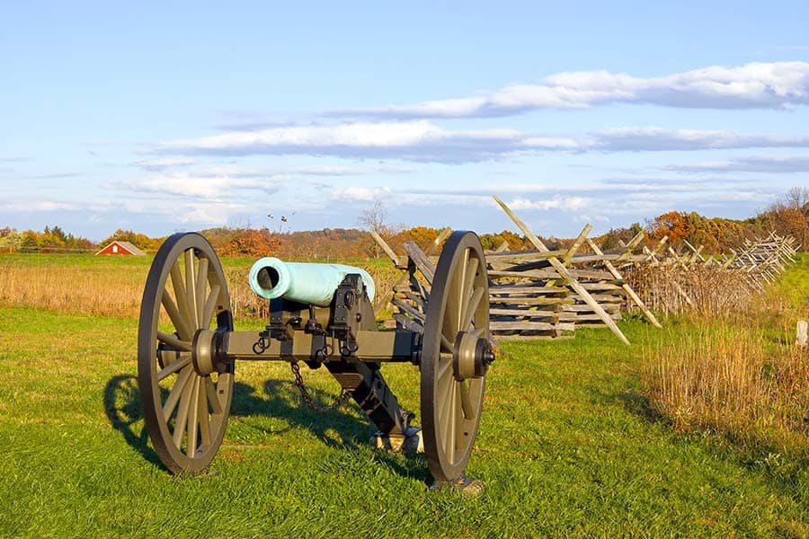 Civil War cannon in grassy battlefield