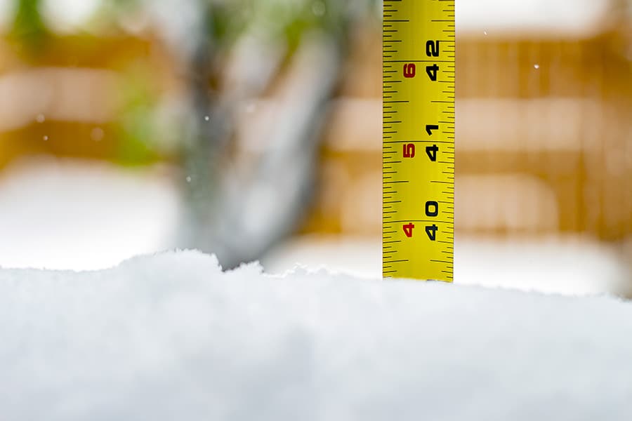 Measuring snow depth with ruler, almost 40 inches of snow