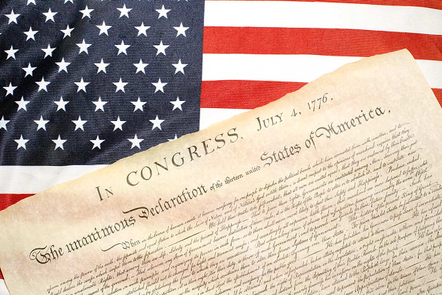 Copy of the Declaration of Independence laying on United States flag