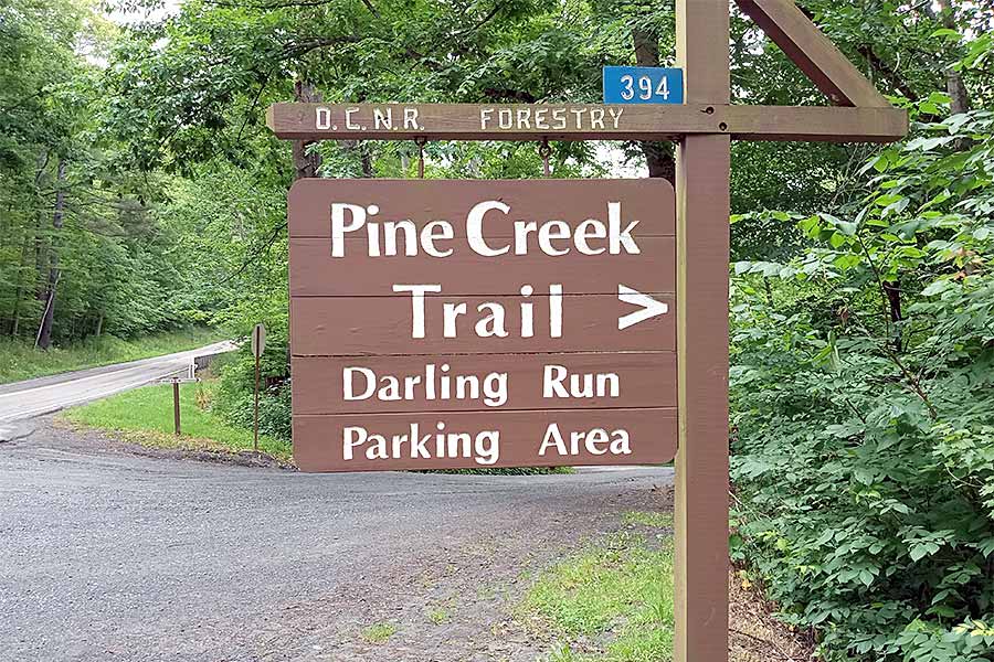 Pine Creek trail sign leading to the rail trail